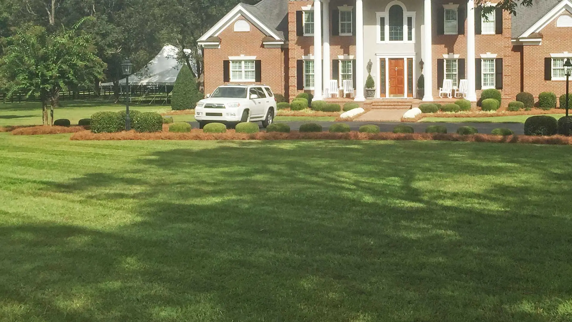 Lawn perfectly mowed in front of a home in Louisville, GA.
