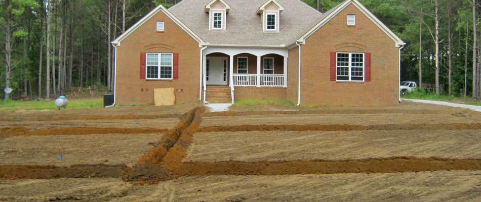 Property in Wrens, GA with trenches dug for irrigation installation.